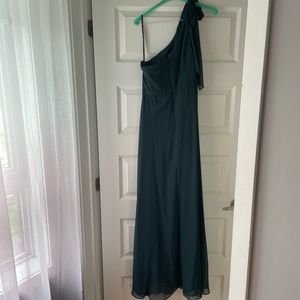 Hunter green bridesmaid’s dress.